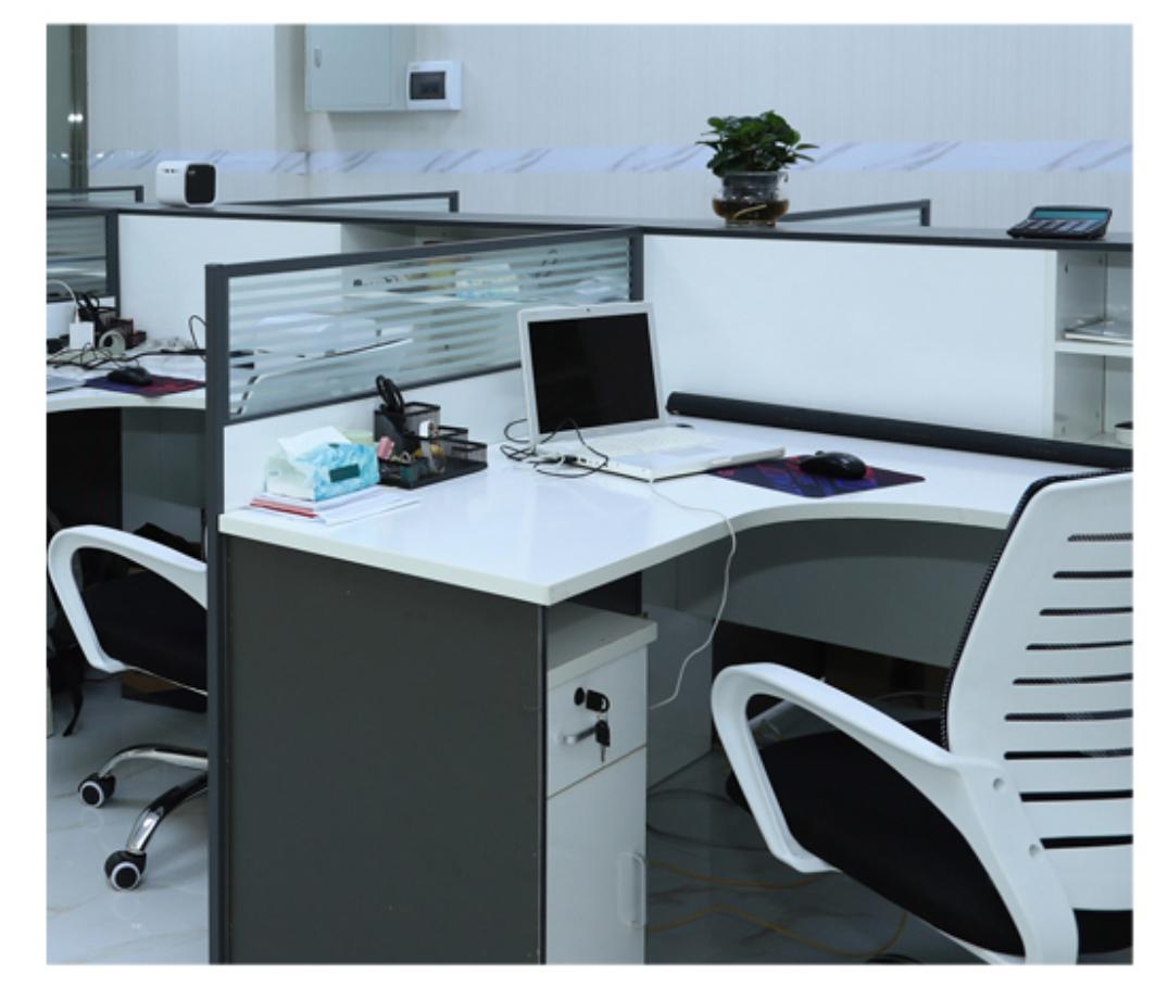 Open-plan office workspace with product development team