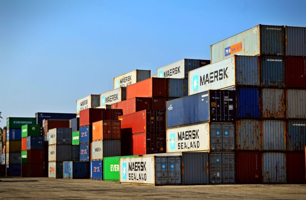 Shipping containers at port for Incoterms and export logistics